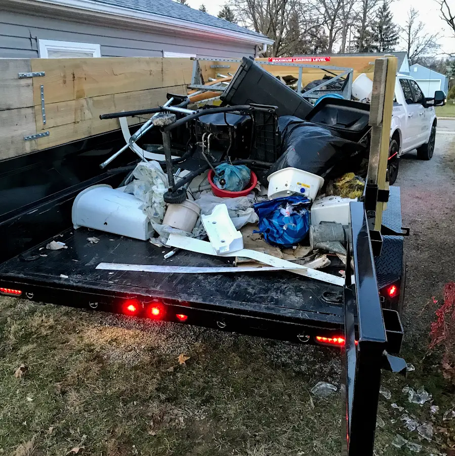 Roll-off dumpster delivered to a residential driveway in Palm Valley